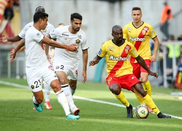 Gael Kakuta of Lens, left Benjamin Andre, Mehmet Zeki Celik of Lille during the Ligue 1 Uber Eats match between RC Lens and Lille OSC at Stade...