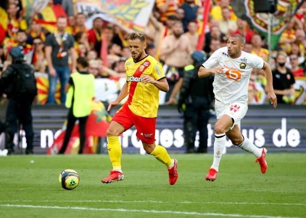 Jonathan Gradit of Lens, Burak Yilmaz of Lille during the Ligue 1 Uber Eats match between RC Lens and Lille OSC at Stade Bollaert-Delelis on...