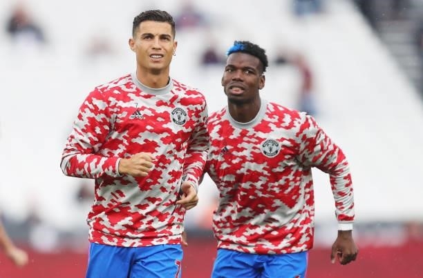 Cristiano Ronaldo of Manchester United is seen warming up with Paul Pogba of Manchester United prior to the Premier League match between West Ham...