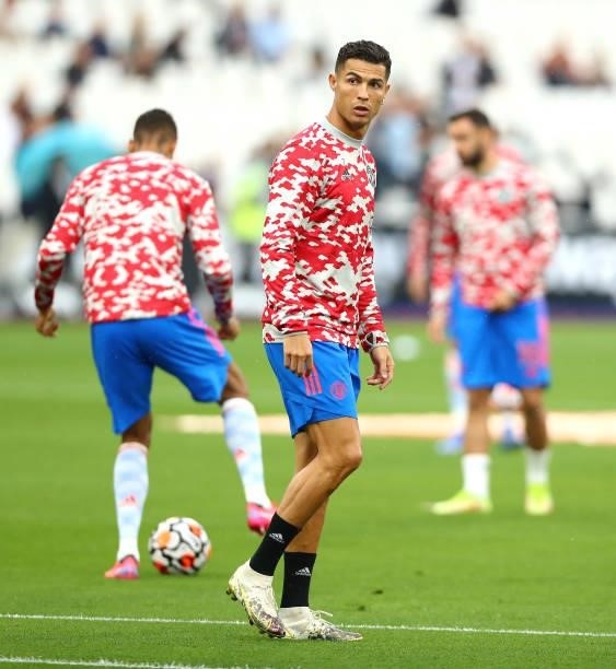 Christiano Ronaldo of Manchester United warms up ahead of the Premier League match between West Ham United and Manchester United at London Stadium on...