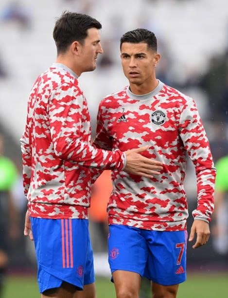 Cristiano Ronaldo of Manchester United warms up with Harry Maguire of Manchester United prior to the Premier League match between West Ham United and...