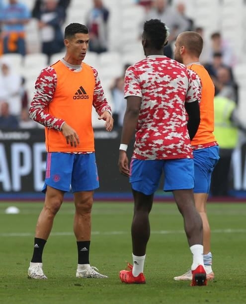 Cristiano Ronaldo and Paul Pogba of Manchester United warm up ahead of the Premier League match between West Ham United and Manchester United at...