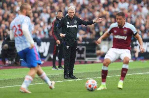 David Moyes, Manager of West Ham United gestures as Luke Shaw of Manchester United makes a pass during the Premier League match between West Ham...
