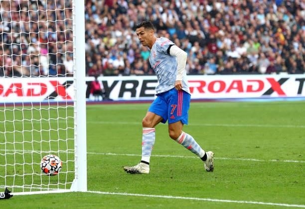 Christiano Ronaldo of Manchester United scores his teams first goal during the Premier League match between West Ham United and Manchester United at...