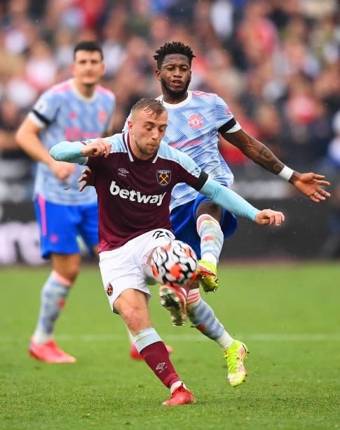 Jarrod Bowen of West Ham United is challenged by Fred of Manchester United during the Premier League match between West Ham United and Manchester...