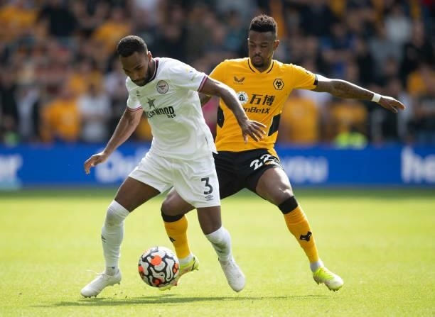 Rico Henry of Brentford and Nélson Semedo of Wolverhampton Wanderers during the Premier League match between Wolverhampton Wanderers and Brentford at...
