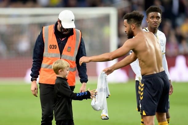 Young Everton fans receives the shirt of Andros Townsend during the Premier League match between Aston Villa and Everton at Villa Park on September...
