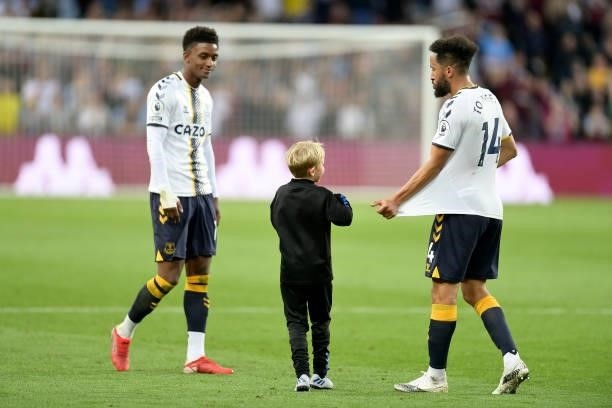 Young Everton fans runs onto the pitch to speak to Demarai Gray and Andros Townsend during the Premier League match between Aston Villa and Everton...