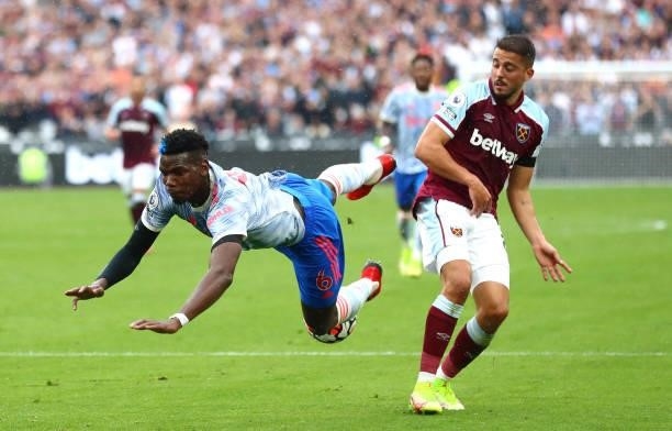 Paul Pogba of Manchester United and Pablo Fornals of West Ham United collide during the Premier League match between West Ham United and Manchester...