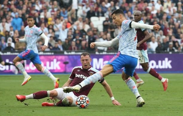 Cristiano Ronaldo of Manchester United in action with Vladimir Coufal of West Ham United during the Premier League match between West Ham United and...