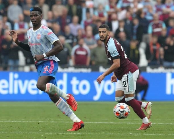 Paul Pogba of Manchester United in action with Said Benrahma of West Ham United during the Premier League match between West Ham United and...