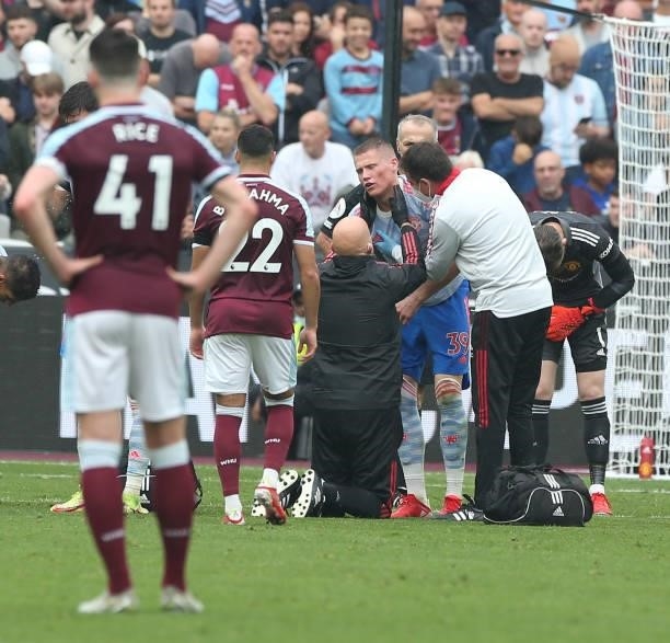 Scott McTominay of Manchester United receives treatment on an injury during the Premier League match between West Ham United and Manchester United at...