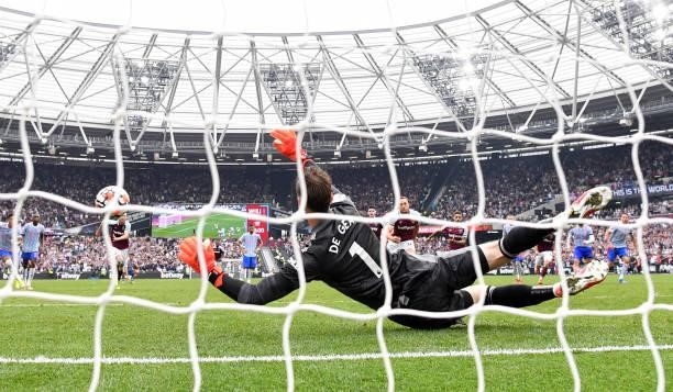 David De Gea of Manchester United saves the penalty taken by Mark Noble of West Ham United during the Premier League match between West Ham United...