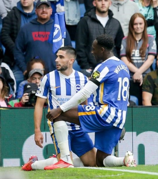 Danny Welbeck congratulates team-mate Neal Maupay of Brighton & Hove Albion after he scores a goal to make it 1-0 from a penalty during the Premier...
