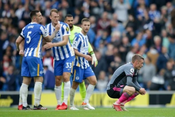 Jamie Vardy of Leicester City reacts after his sides 2-1 defeat as Brighton players celebrate in background during the Premier League match between...