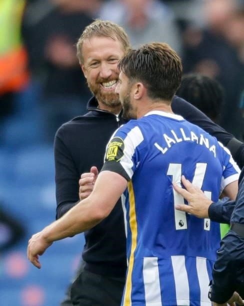 Head Coach Graham Potter with Adam Lallana of Brighton & Hove Albion after their sides 2-1 win during the Premier League match between Brighton &...