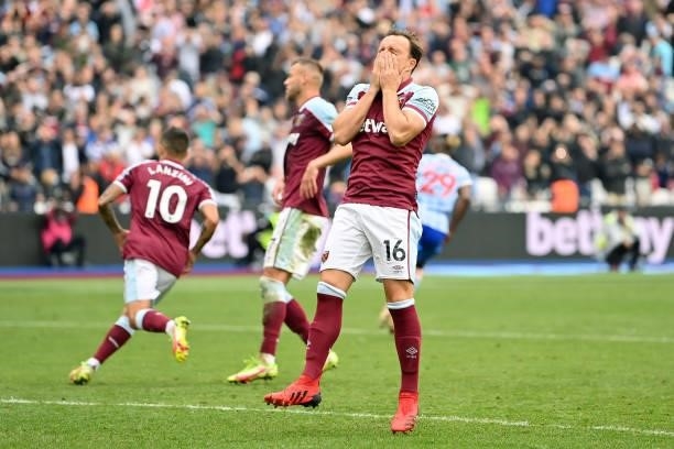 Mark Noble of West Ham United reacts after missing a penalty which was saved by David De Gea of Manchester United during the Premier League match...