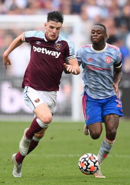 Declan Rice of West Ham United takes on Aaron Wan-Bissaka of Manchester United during the Premier League match between West Ham United and Manchester...
