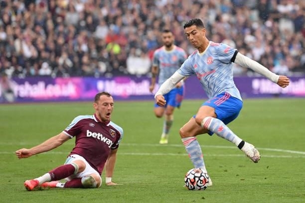 Cristiano Ronaldo of Manchester United takes on Vladimir Coufal of West Ham United during the Premier League match between West Ham United and...