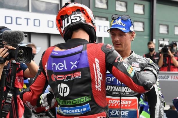 Jordi Torres of Spain and Pons Racing 40 speaks with Dominique Aegerter of Germany and Dynavolt Intact GP under the podium during the MotoE race 2...