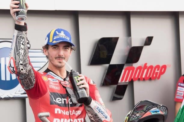 Francesco Bagnaia of Italy and Ducati Lenovo Team celebrates the victory under the podium during the MotoGP race during the MotoGP Of San Marino -...