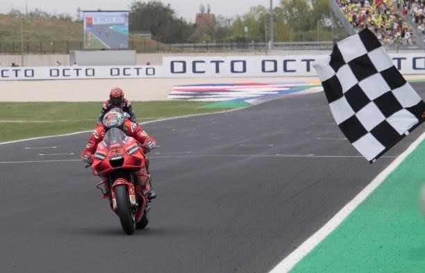 Francesco Bagnaia of Italy and Ducati Lenovo Team cuts the finish lane and celebrates the victory during the MotoGP race during the MotoGP Of San...