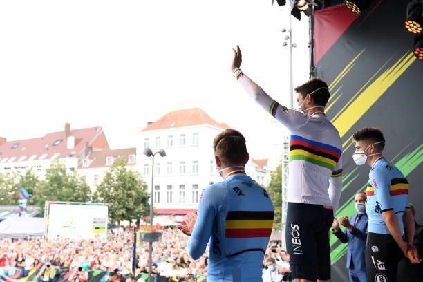 Bronze medalist Remco Evenepoel of Belgium, Gold medalist Filippo Ganna of Italy and Silver medalist Wout Van Aert of Belgium pose and wave the fans...