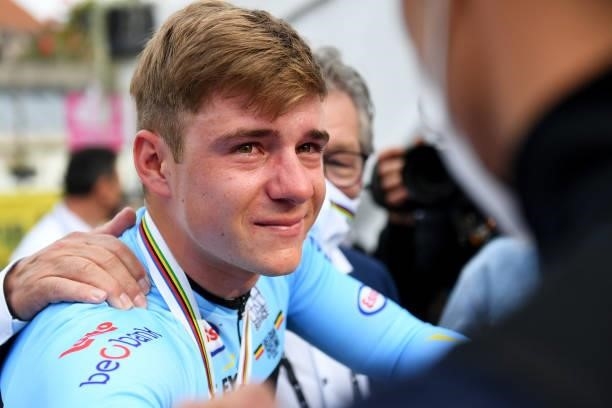 Remco Evenepoel of Belgium bronze medalistis is comforted by his team staff after competing in the 94th UCI Road World Championships 2021 - Men Elite...