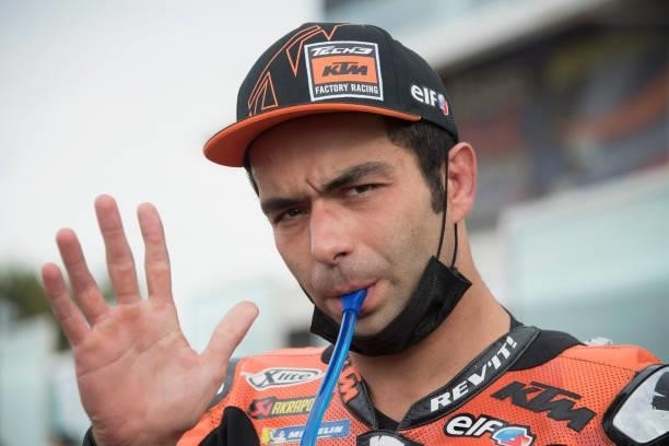 Danilo Petrucci of Italy and Red Bull KTM Factory Racing greets and prepares to start on the grid during the MotoGP race during the MotoGP Of San...