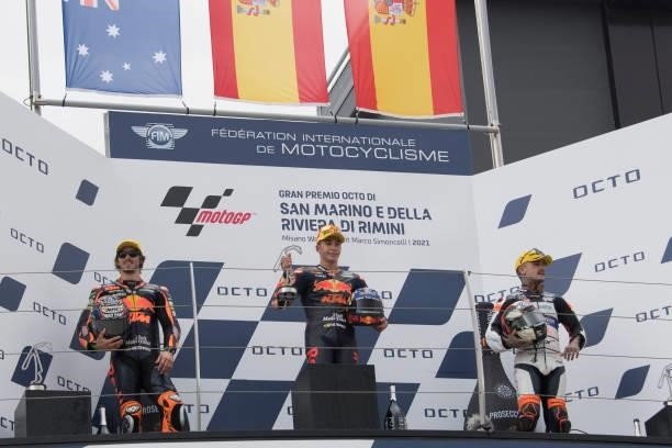 Remy Gardner of Australia and Red Bull KTM Ajo, Raul Fernandez of Spain and Red Bull KTM Ajo and Aron Canet of Spain and Inde Aspar Team celebrate on...