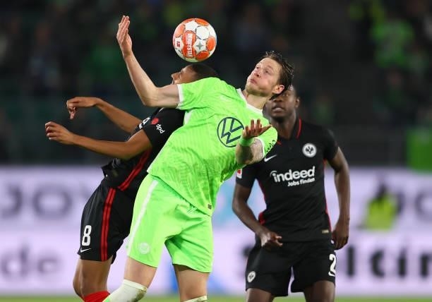 Wout Weghorst of Wolfsburg heads for the ball with Djibril Sow of Frankfurt during the Bundesliga match between VfL Wolfsburg and Eintracht Frankfurt...