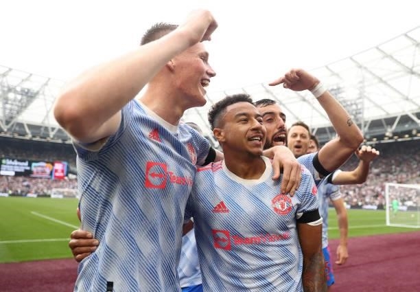 Jesse Lingard of Manchester United celebrates with teammates after scoring their side's second goal during the Premier League match between West Ham...