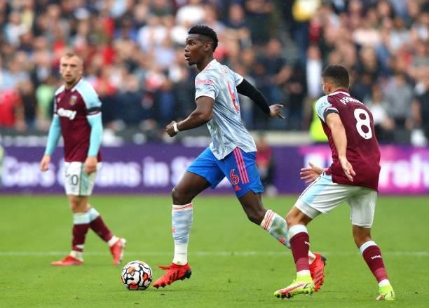 Paul Pogba of Manchester United controls the ball during the Premier League match between West Ham United and Manchester United at London Stadium on...