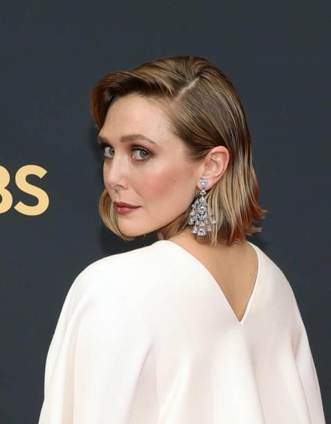 Elizabeth Olsen, jewelry detail, attends the 73rd Primetime Emmy Awards at L.A. LIVE on September 19, 2021 in Los Angeles, California.