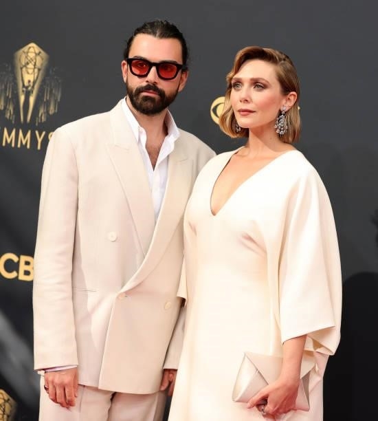 Robbie Arnett and Elizabeth Olsen attend the 73rd Primetime Emmy Awards at L.A. LIVE on September 19, 2021 in Los Angeles, California.