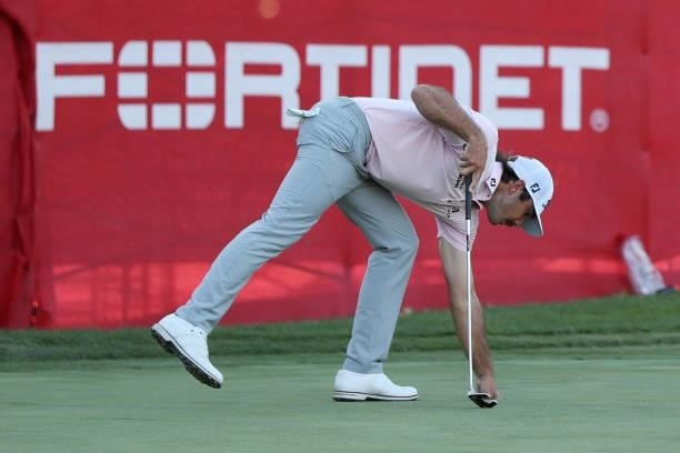 Max Homa retrieves his ball after putting on the 18th hole during the final round of the Fortinet Championship at Silverado Resort and Spa on...