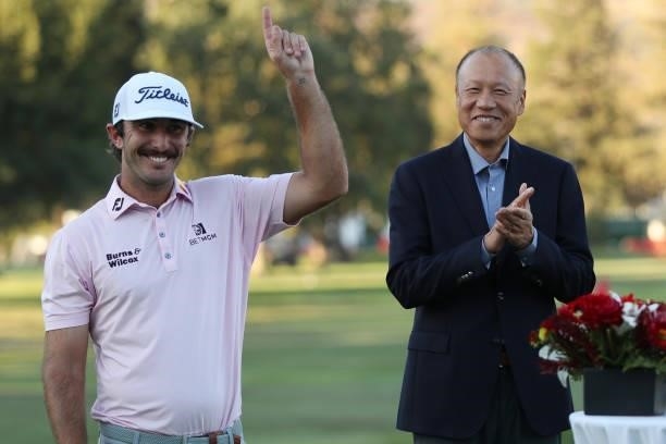 Max Homa celebrates with Fortinet Founder And CEO Ken Xie following his win of the Fortinet Championship at Silverado Resort and Spa on September 19,...
