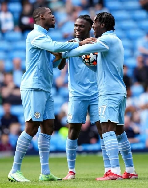 Luke Mbete, Romeo Lavia and Josh Wilson-Esbrand of Manchester City warm up during the Premier League match between Manchester City and Southampton at...