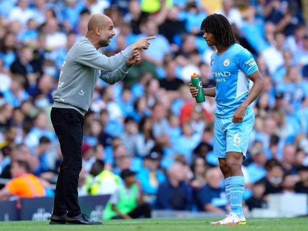Pep Guardiola, manager of Manchester City speaks with Nathan Ake during the Premier League match between Manchester City and Southampton at Etihad...
