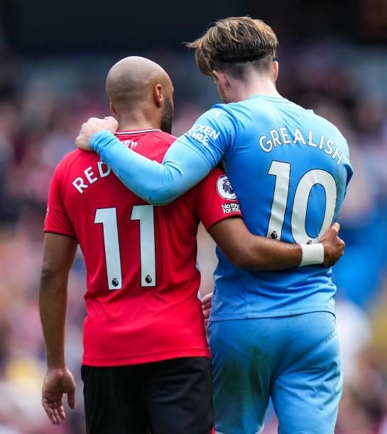 Nathan Redmond of Southampton and Jack Grealish of Manchester City speak during the Premier League match between Manchester City and Southampton at...