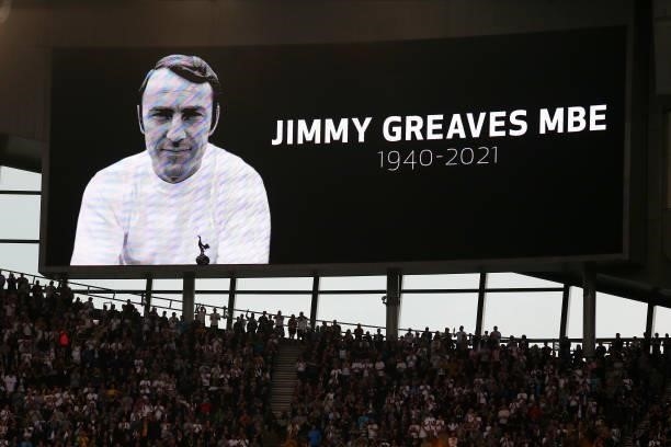 Fans, players and officials observe a minutes applause in memory of Jimmy Greaves prior the Premier League match between Tottenham Hotspur and...