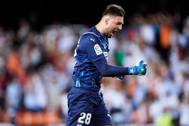 Giorgi Mamardashvili of Valencia celebrates after teammate Hugo Duro scores their side's first goal during the La Liga Santander match between...