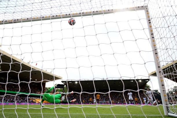 David Raya of Brentford dives as Adama Traore shot hits the cross bar during the Premier League match between Wolverhampton Wanderers and Brentford...