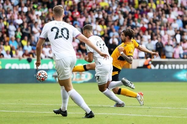 Ruben Neves of Wolverhampton Wanderers shoots during the Premier League match between Wolverhampton Wanderers and Brentford at Molineux on September...