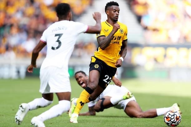 Nelson Semedo of Wolverhampton Wanderers is challenged by Ivan Toney of Brentford during the Premier League match between Wolverhampton Wanderers and...