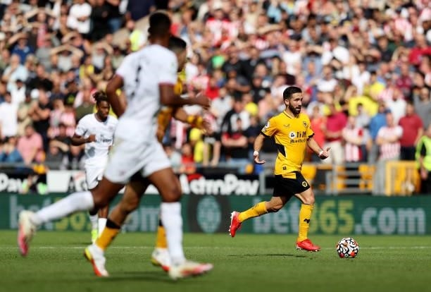 Joao Moutinho of Wolverhampton Wanderers runs with the ball during the Premier League match between Wolverhampton Wanderers and Brentford at Molineux...