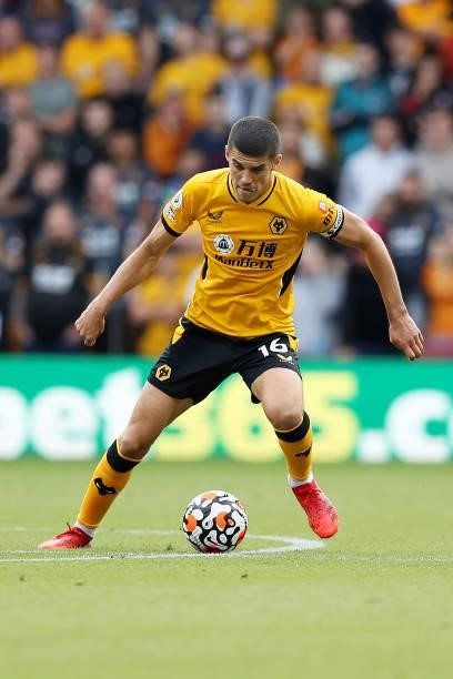 Conor Coady of Wolverhampton Wanderers runs with the ball during the Premier League match between Wolverhampton Wanderers and Brentford at Molineux...