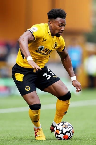 Adama Traore of Wolverhampton Wanderers runs with the ball during the Premier League match between Wolverhampton Wanderers and Brentford at Molineux...