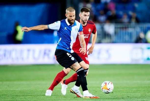 Victor Laguardia of Deportivo Alaves duels for the ball with Jon Moncayola of CA Osasuna during the La Liga Santander match between Deportivo Alaves...