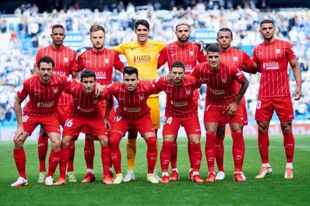 Sevilla FC line up for a team photo prior to the La Liga Santander match between Real Sociedad and Sevilla FC at Reale Arena on September 19, 2021 in...